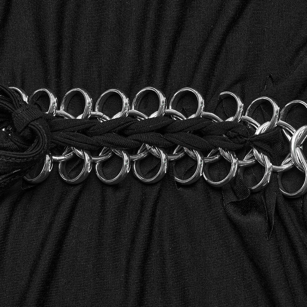 Close-up of punk-rock black crop top chain detail featuring intricate silver metal loops and braided accents.