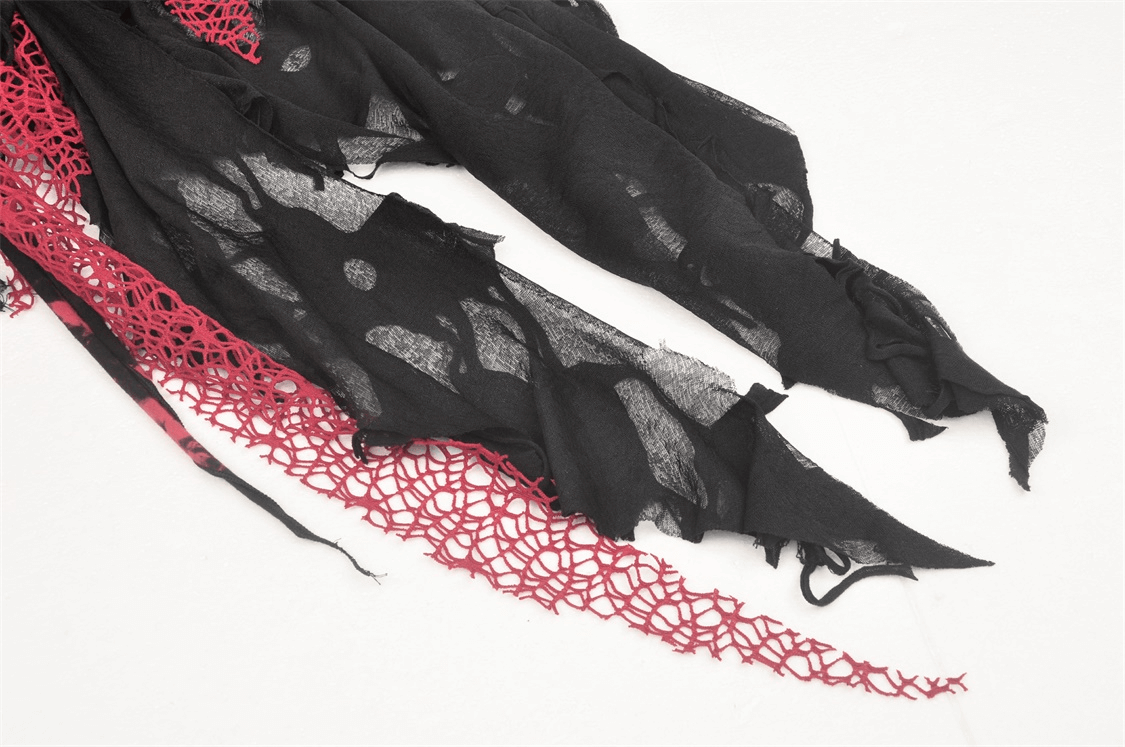 Detailed view of a black punk rock dress with red mesh lace and irregular hems, perfect for gothic style enthusiasts.