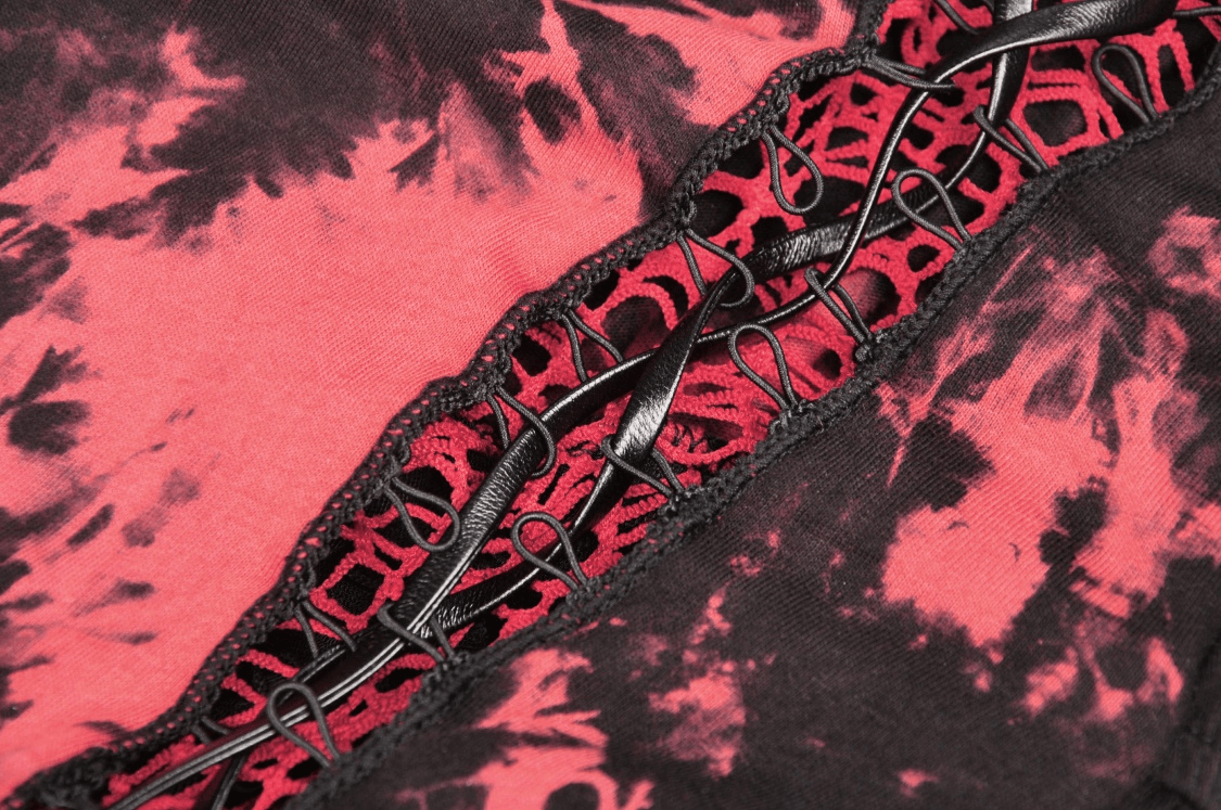 Close-up of a stylish punk dress featuring blood-red mesh, intricate straps, and a vivid tie-dye pattern.
