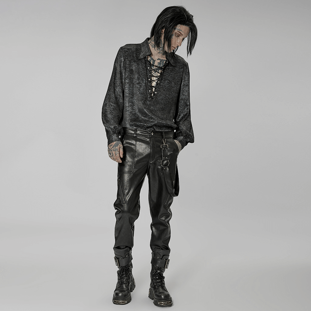 Stylish punk rock outfit featuring faux leather lace-up pants and a dark textured shirt for edgy streetwear flair.