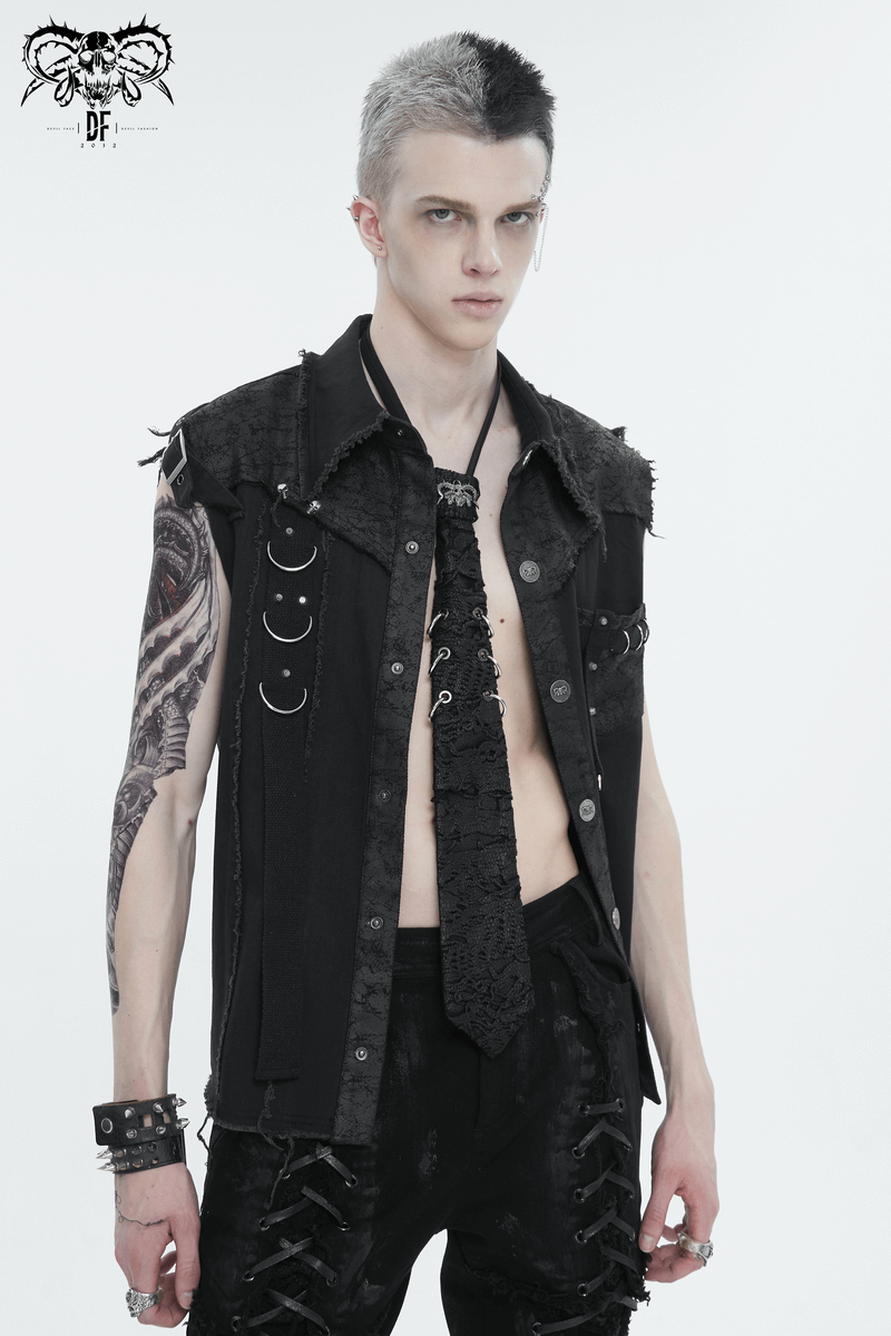 Stylish male model wearing punk skull necktie with rings and edgy attire in gothic style.