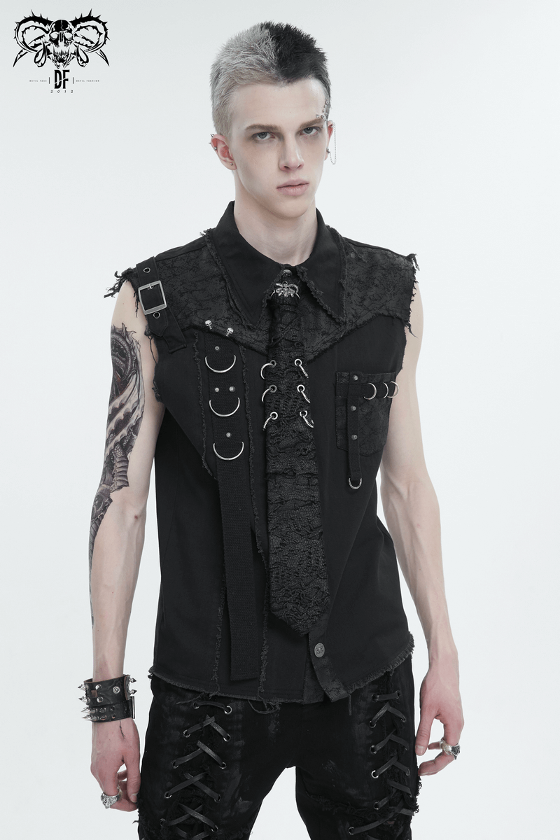 Stylish male model in punk-inspired outfit with skull necktie and decorative rings, making a bold gothic fashion statement.