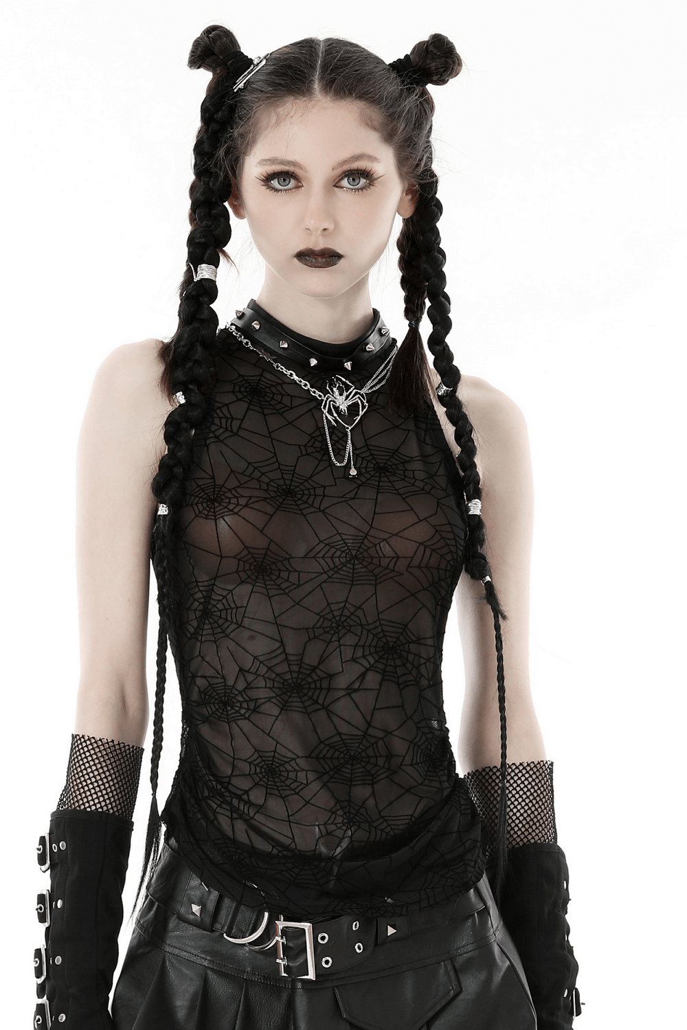 Stylish punk model wearing sleeveless black spiderweb mesh t-shirt, showcasing gothic fashion with bold accessories.