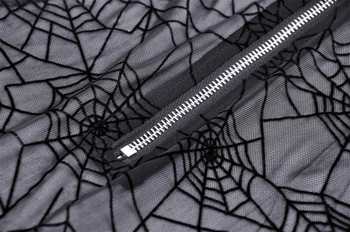 Close-up of stylish black mesh fabric with intricate spiderweb design, featuring a zip closure for a gothic T-shirt.