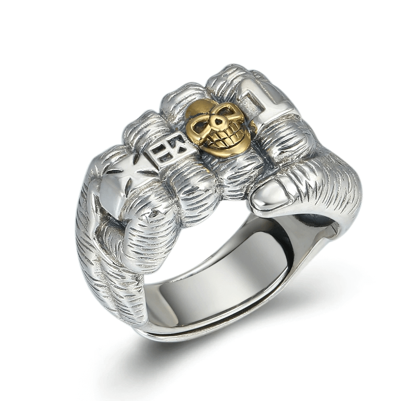 Stylish unisex sterling silver fist-shaped ring with skull detail, perfect casual accessory for men and women.