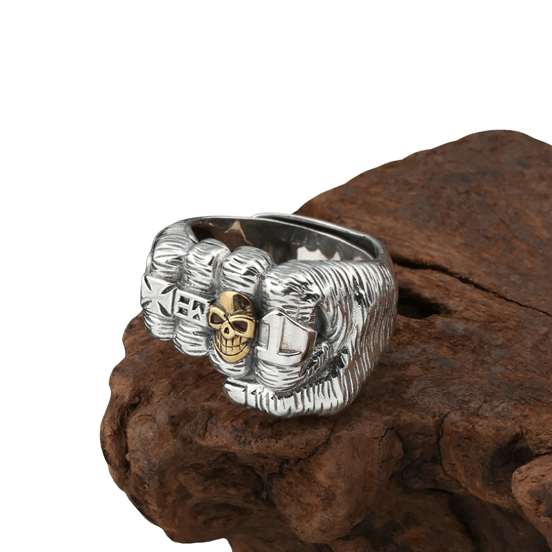 Stylish unisex fist-shaped ring with skull design, crafted from sterling silver and perfect for casual accessory lovers.