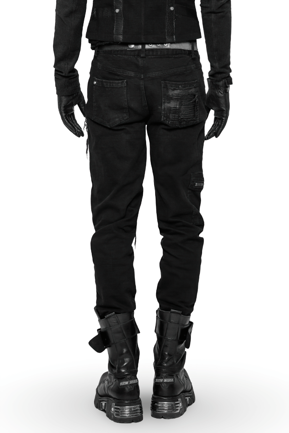 Back view of stylish ripped black cargo pants with edgy zip details, worn with black gloves and chunky boots.