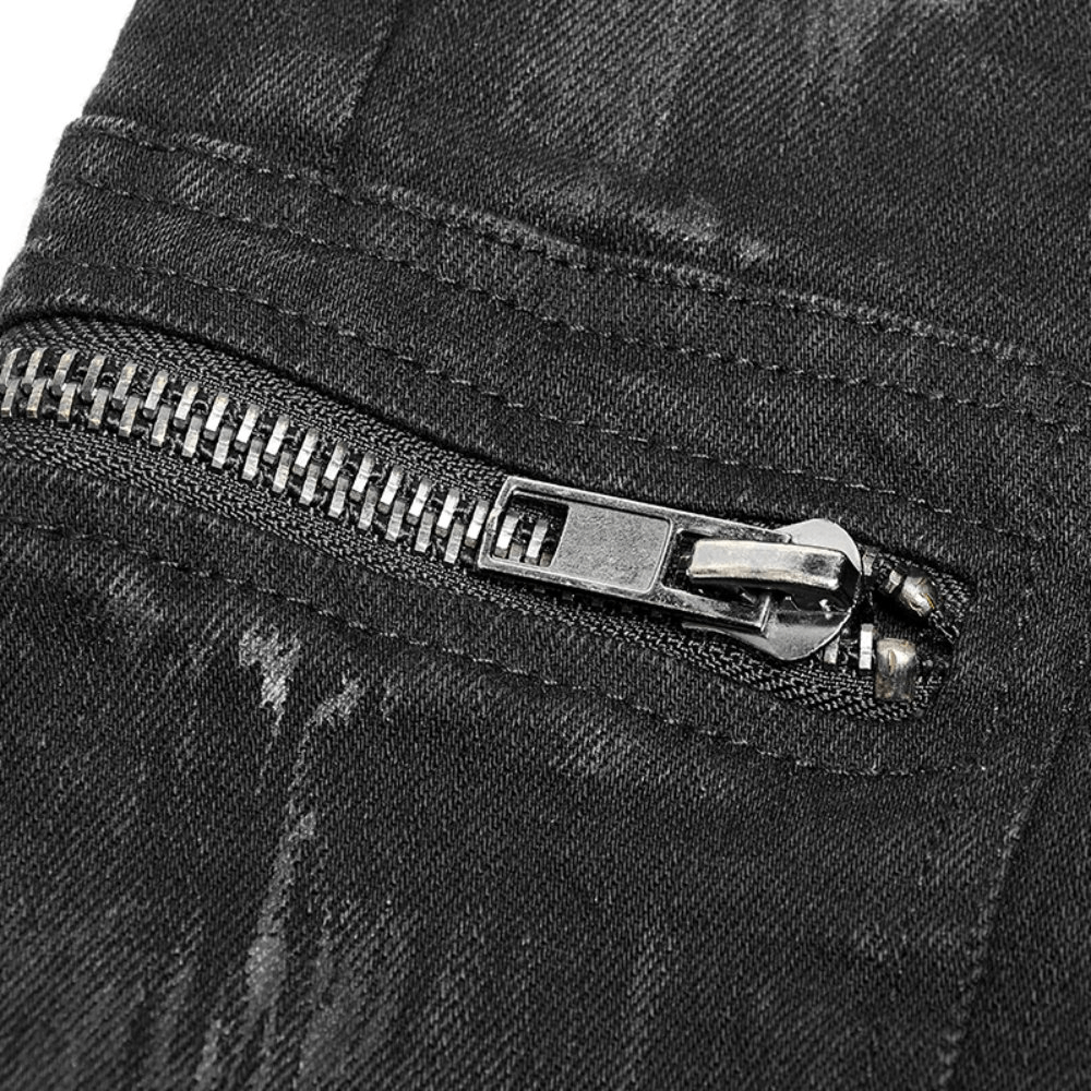 Close-up of stylish ripped black cargo pants with edgy zip detail, showcasing unique distressed fabric and craftsmanship.