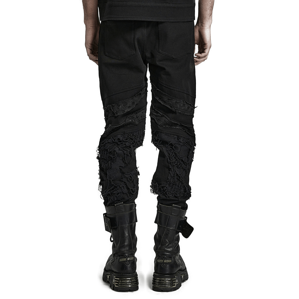 Back view of stylish ripped black gothic trousers for men showcasing edgy textured design and streetwear flair.
