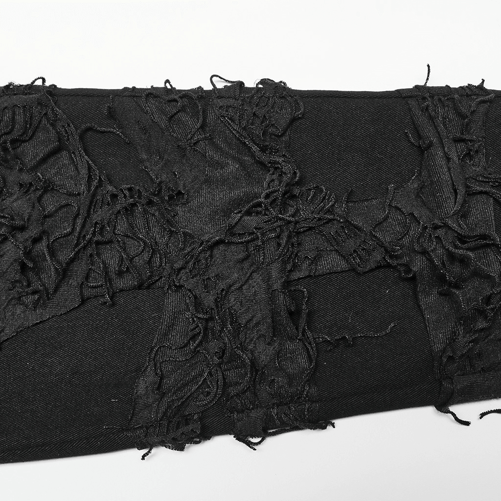 Close-up of stylish ripped knit black trousers for men in gothic style, showcasing edgy distressed texture.