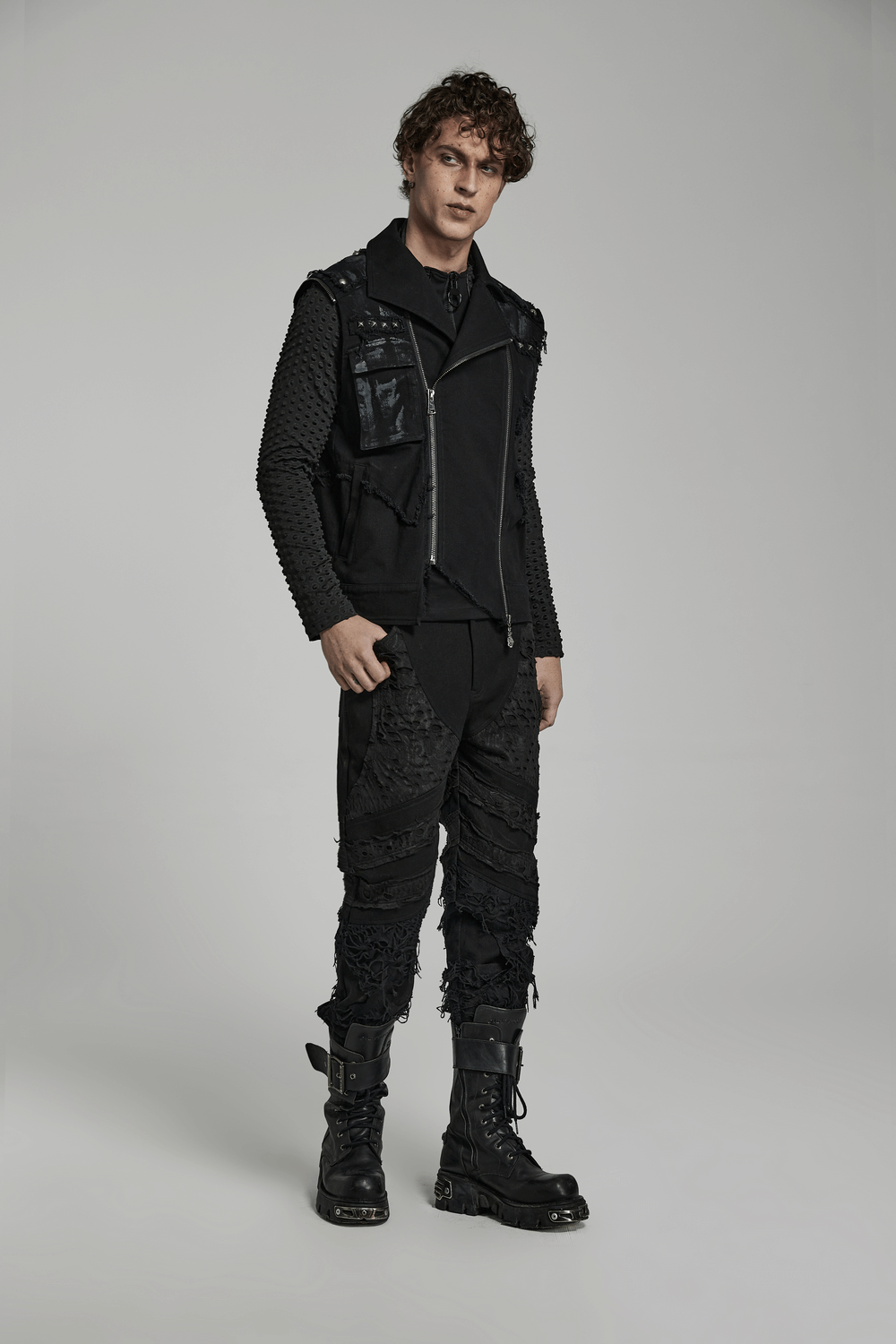 Stylish ripped knit black gothic trousers for men, featuring edgy textures and a dark streetwear vibe.