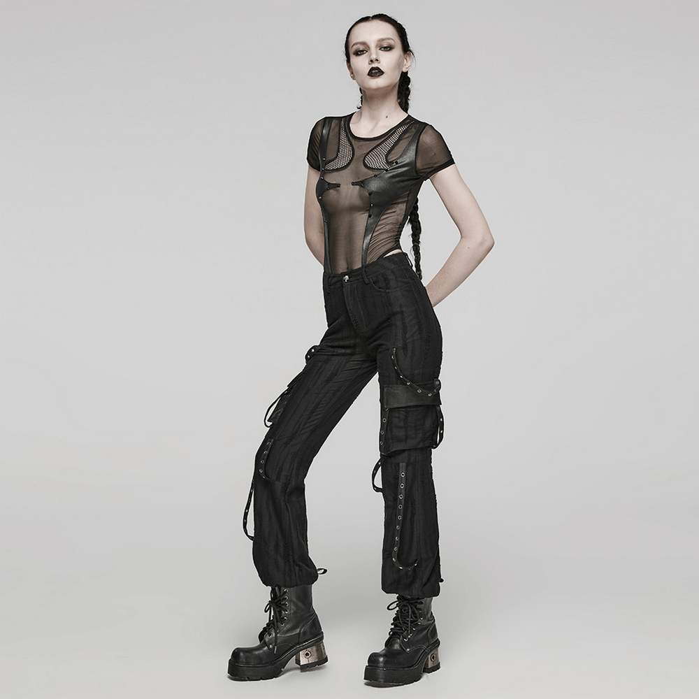 Edgy model showcasing a stylish black sheer mesh bodysuit with high-waisted cargo pants and chunky boots.