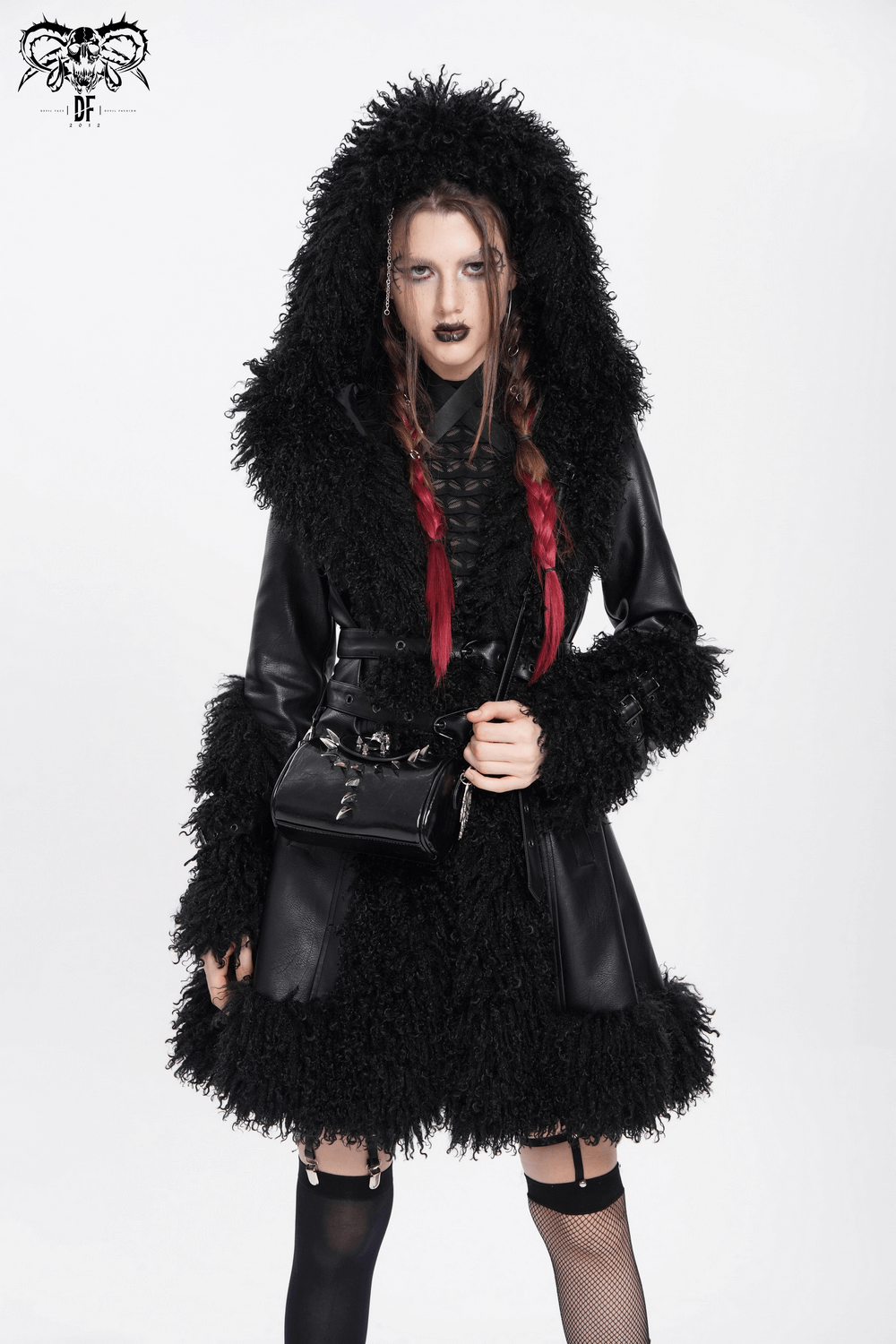 Model in a chic black faux fur coat with a hood, showcasing a bold fashion statement and gothic style.