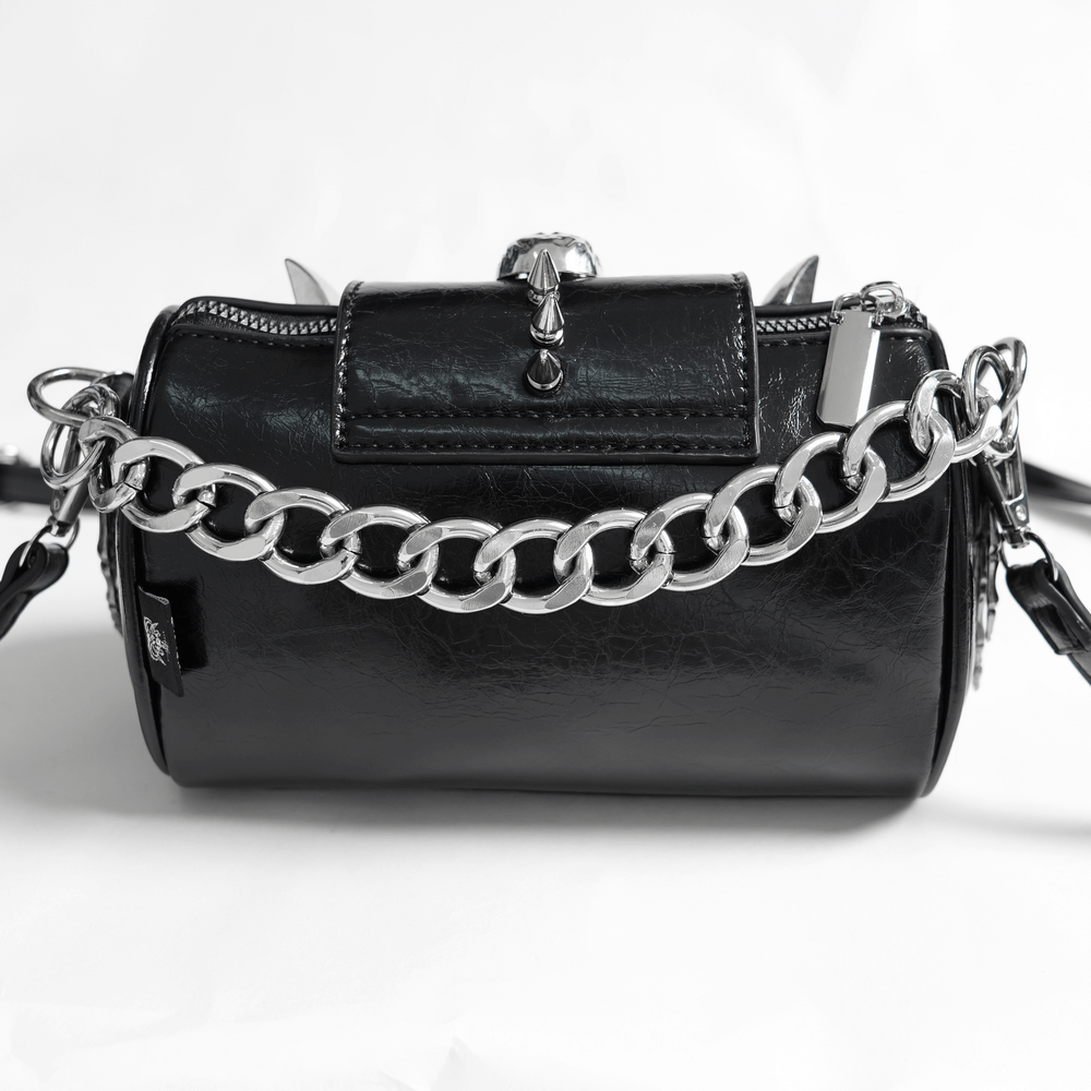 Stylish black leather crossbody bag with bold silver chain and zipper, perfect for any occasion.