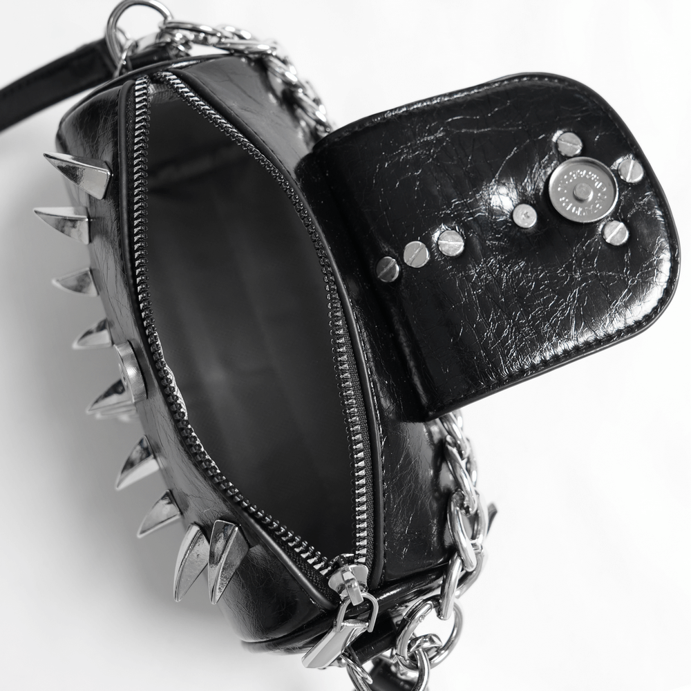Stylish black leather shoulder bag with spikes and silver chain, showcasing zipper and pocket for chic organization.