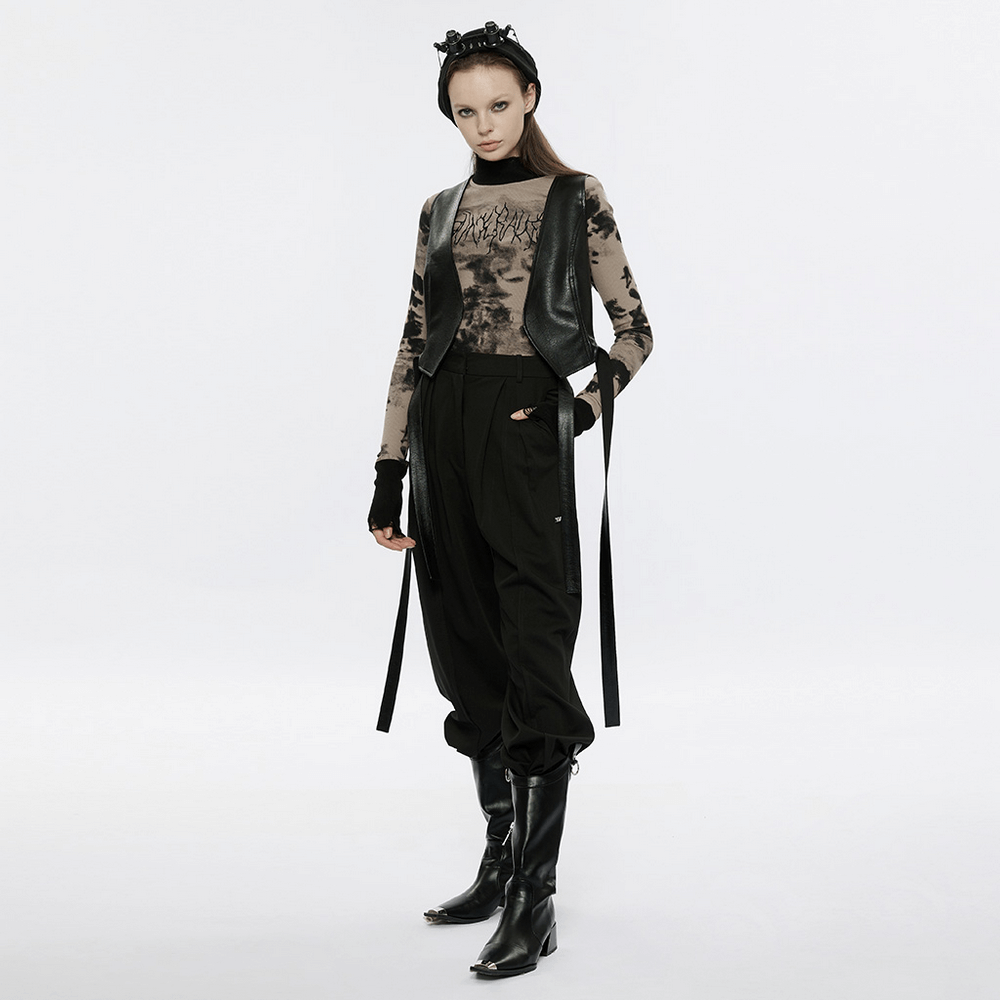 Model wearing stylish tie dye turtleneck top with ripped cuffs, punk vibe and edgy streetwear look.