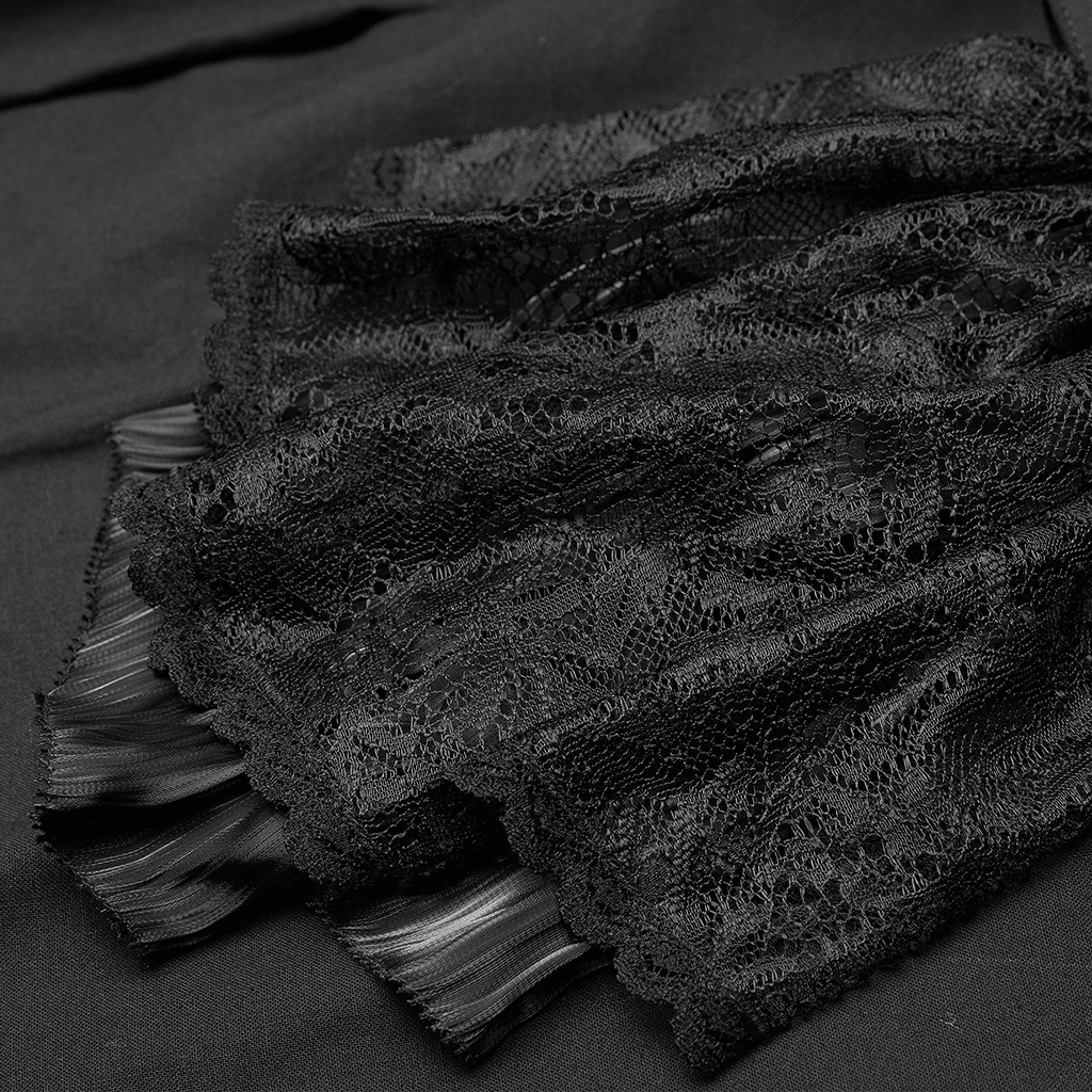 Close-up of elegant black lace detailing on a stylish garment, showcasing intricate patterns and textures.