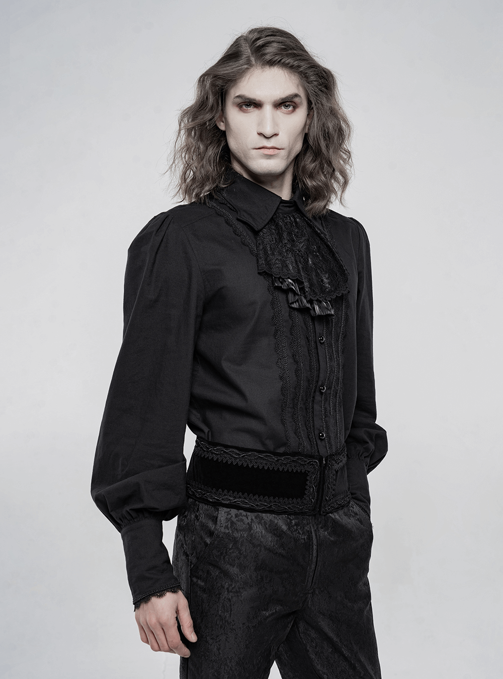 Gothic Victorian-style men's long sleeve cotton shirt with ruffles and button details, styled elegantly in black.