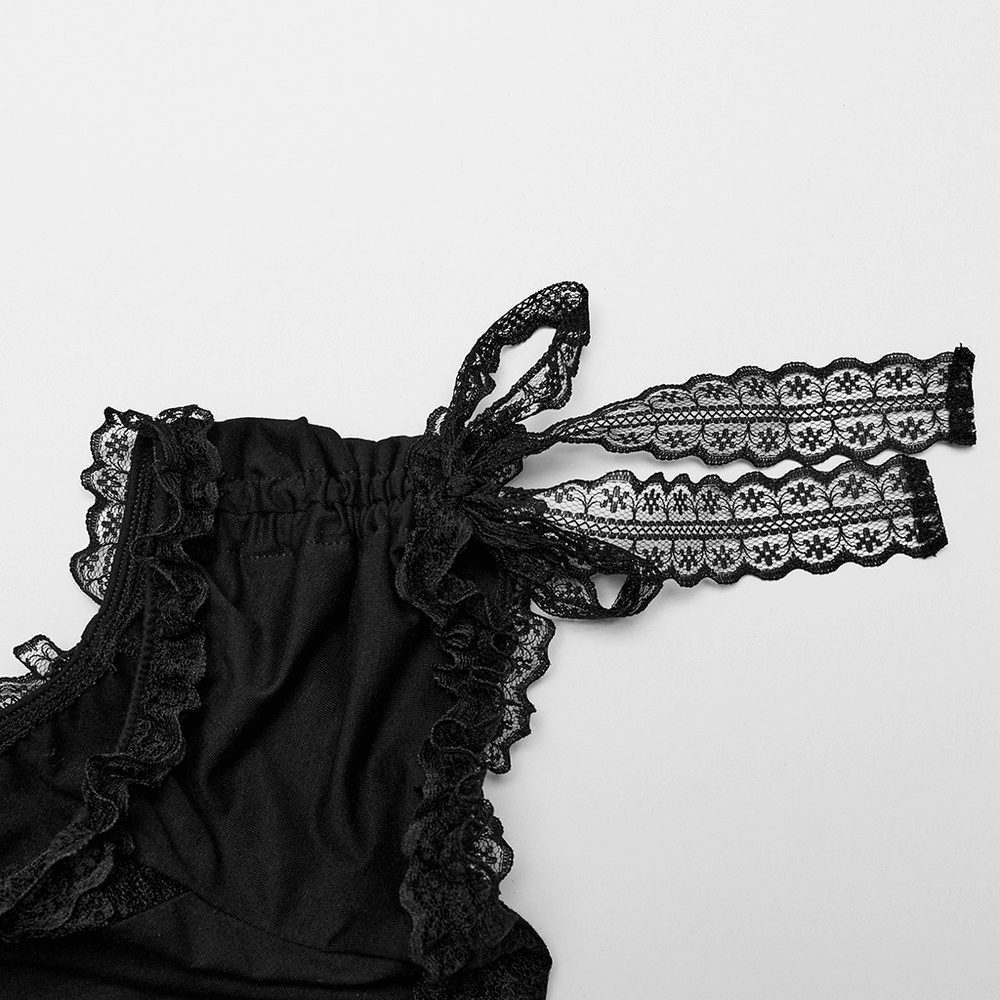 Close-up of black sheer lace off-the-shoulder top with adjustable lace string sleeves and ruffled details.