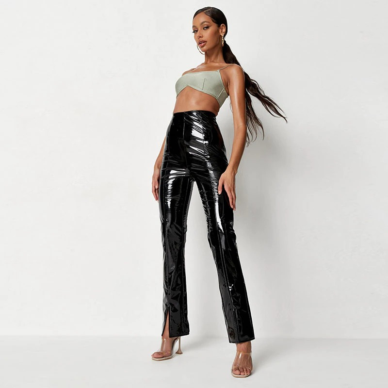 Stylish women's high waist black faux patent leather straight pants with slits, perfect for a rock-inspired look.