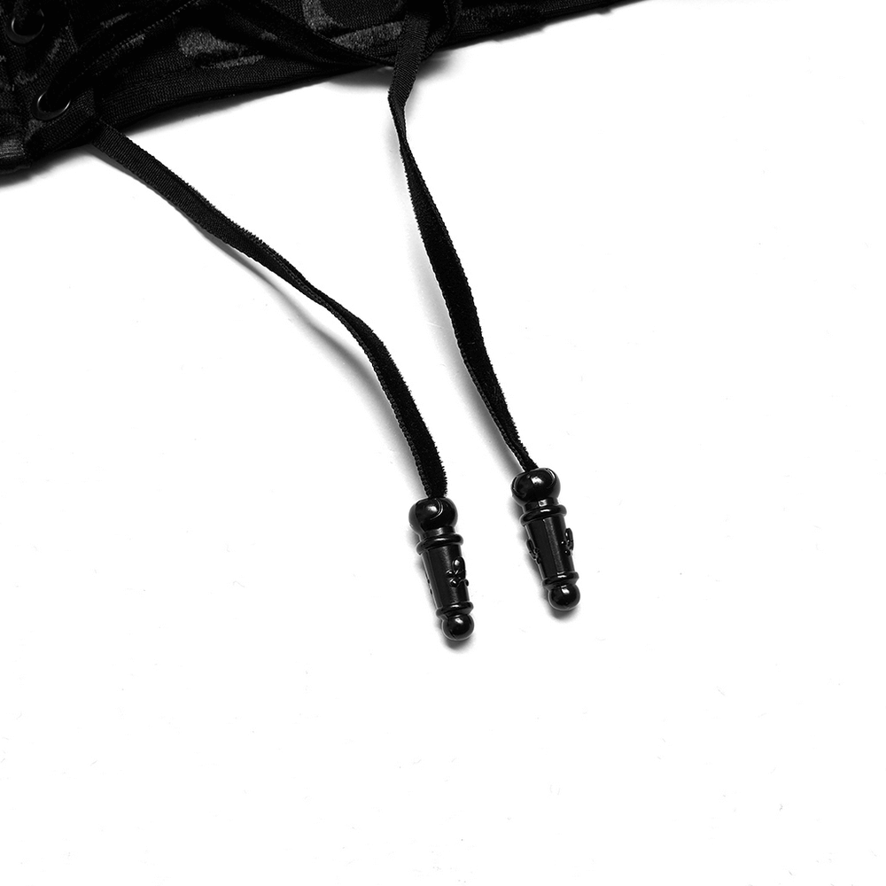 Close-up of black lace-up detail on a stylish women's corset belt, featuring intricate design and adjustable ties.