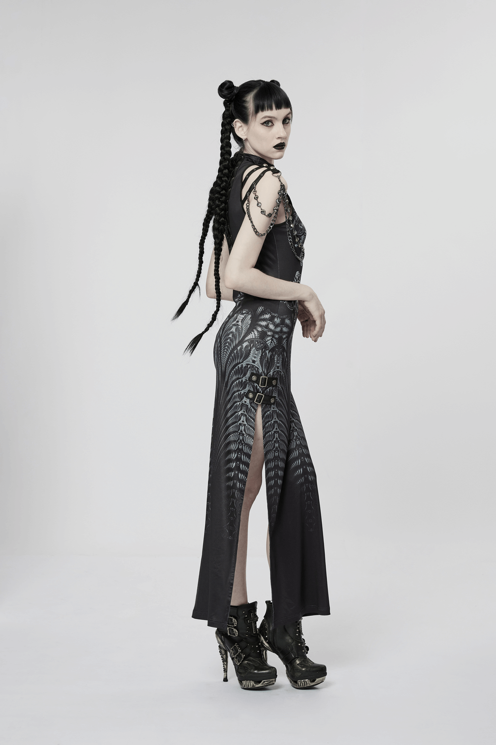 Stylish woman in a futuristic sci-fi printed dress with a split design and edgy accessories, showcasing a bold cyber aesthetic.