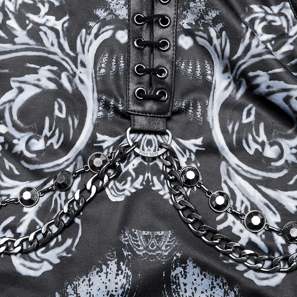 Close-up of stylish women's futuristic dress detail with decorative leather loops and chains.