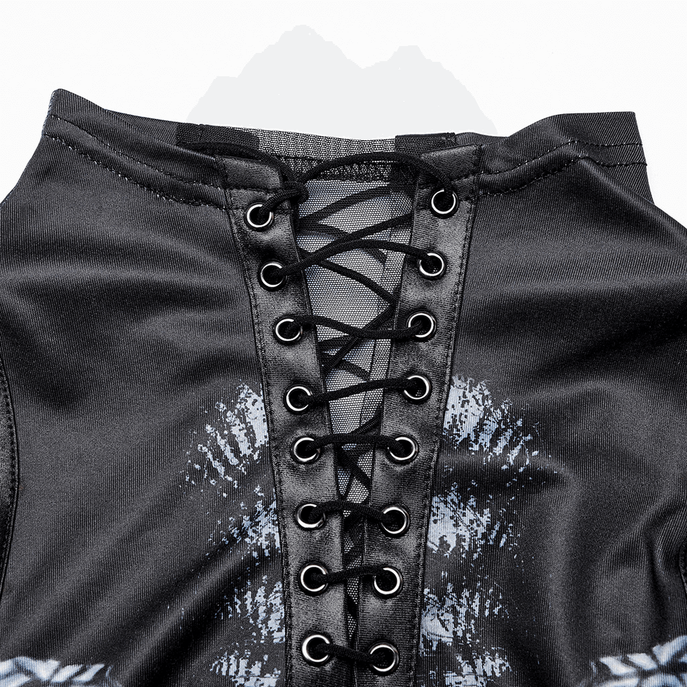 Close-up of stylish women's futuristic dress featuring lace-up detail and sleek black fabric.