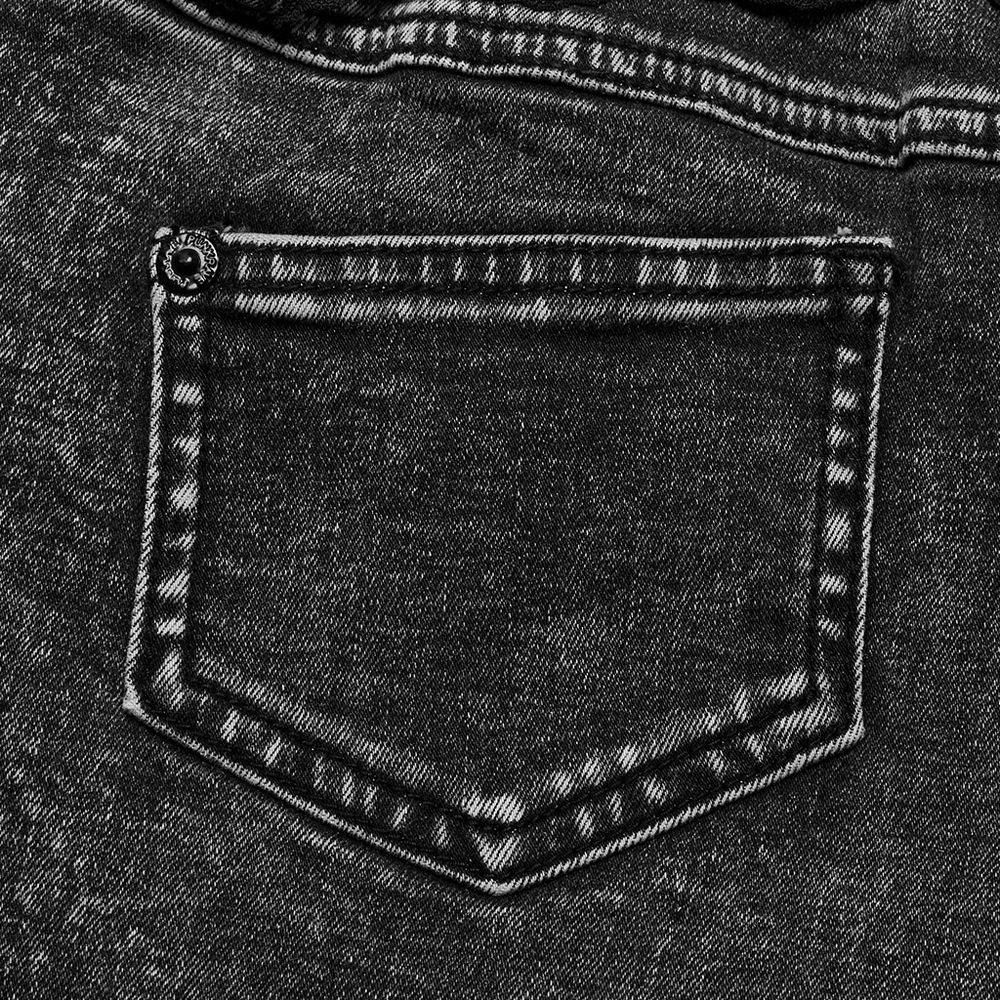 Close-up of a stylish black denim short pocket showcasing unique stitching details.