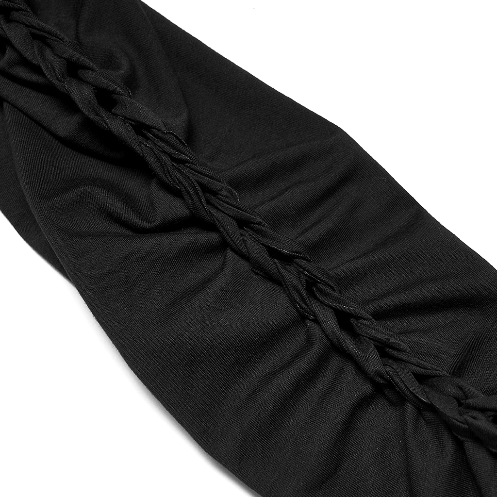 Close-up of stylish black knit fabric featuring intricate braided chain detail.