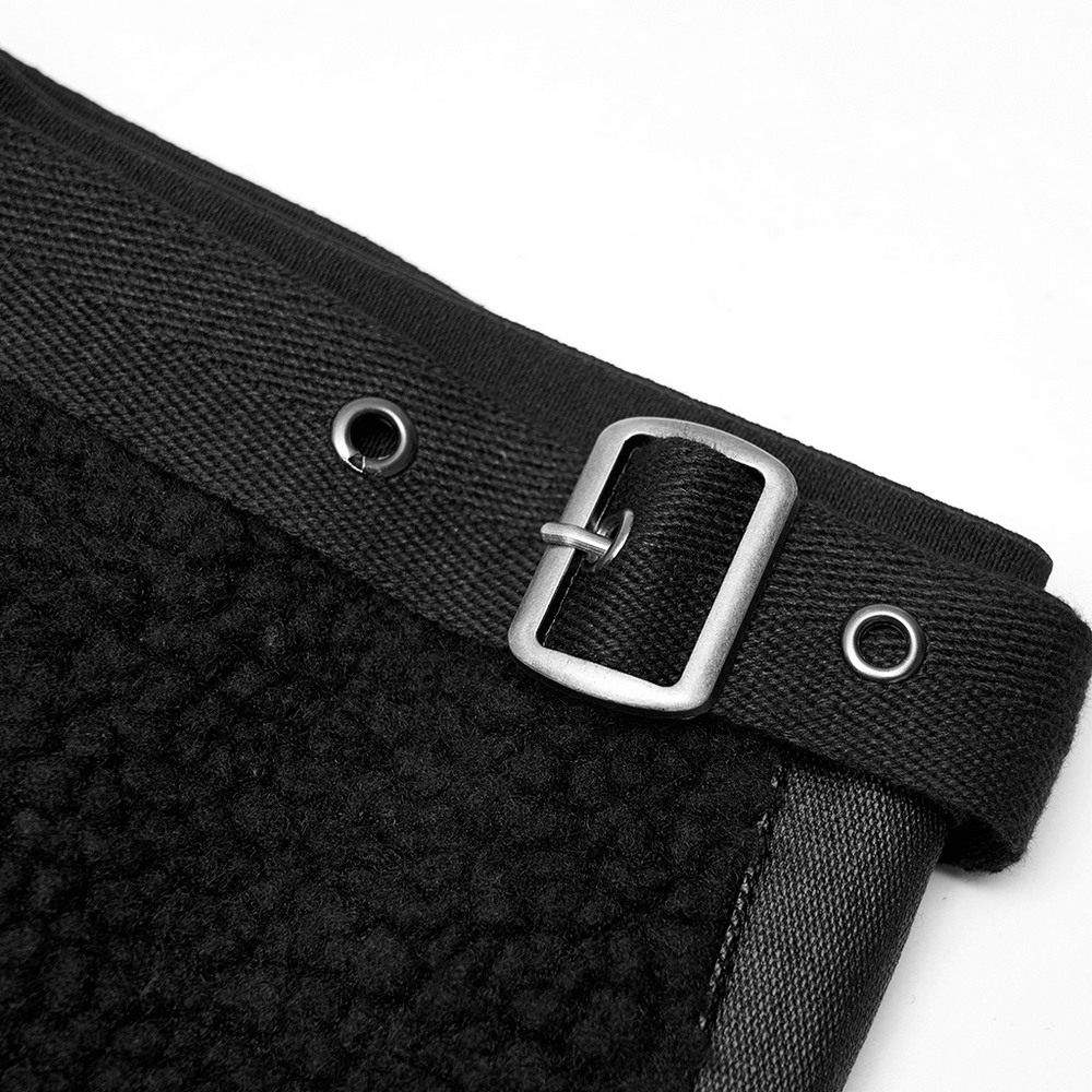 Close-up of adjustable metal button on stylish black cashmere leg warmers, highlighting punk-inspired design.