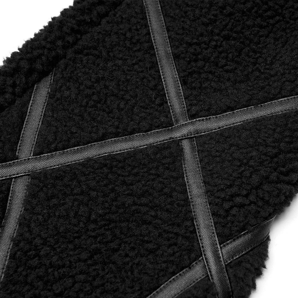 Close-up of stylish black leg warmer with plush texture and crisscross satin ribbons, perfect for a punk-inspired look.