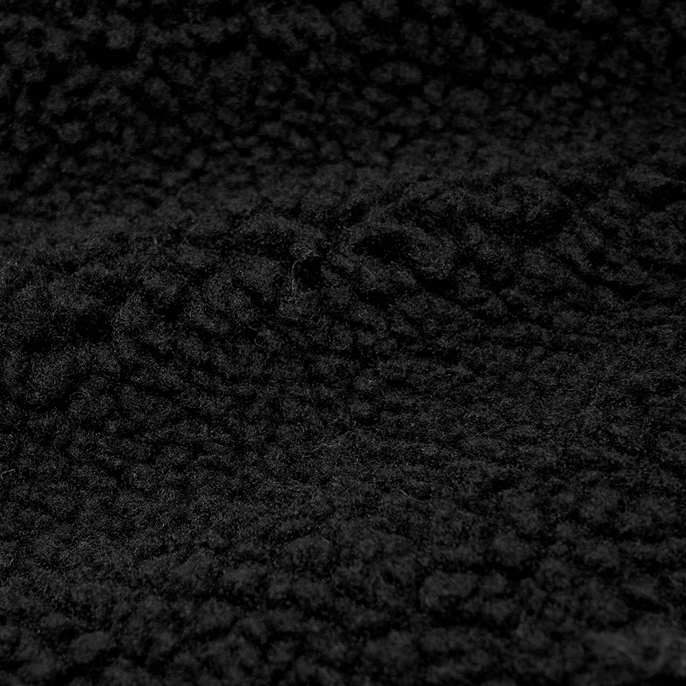 Close-up of soft black cashmere fabric texture, ideal for stylish warm clothing design.