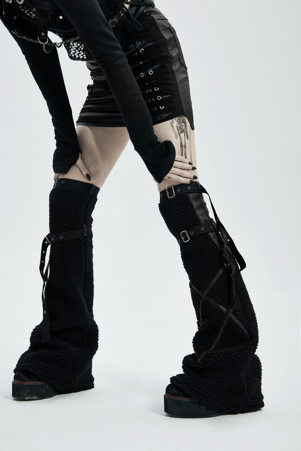 Punk-inspired stylish leg warmers featuring leopard cashmere and adjustable straps for a cozy yet edgy look.