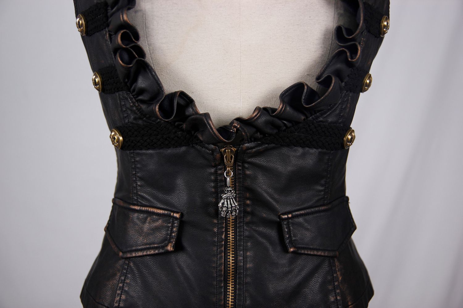 Stylish women's black PU leather steampunk waistcoat with gold buttons and frills for trendy outfits.