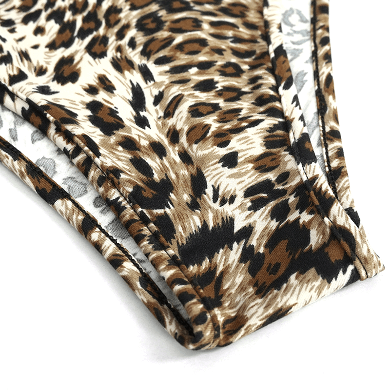 Close-up of stylish women's two-piece leopard print swimsuit, showcasing trendy fabric and modern design details.