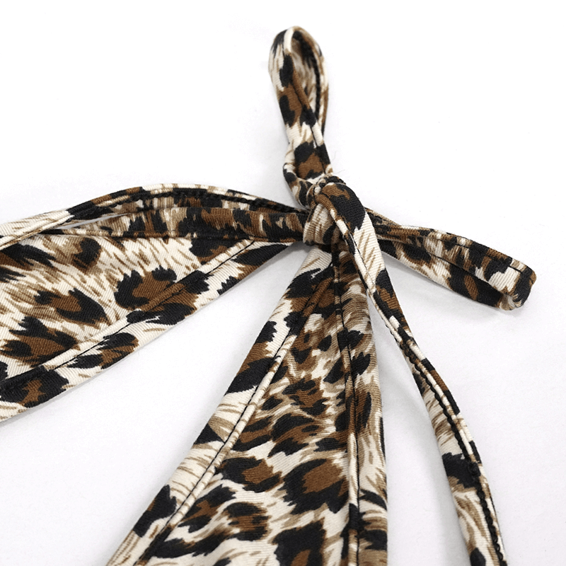 Close-up of stylish leopard print swimsuit laces, showcasing trendy knot design for women's two-piece swimwear.