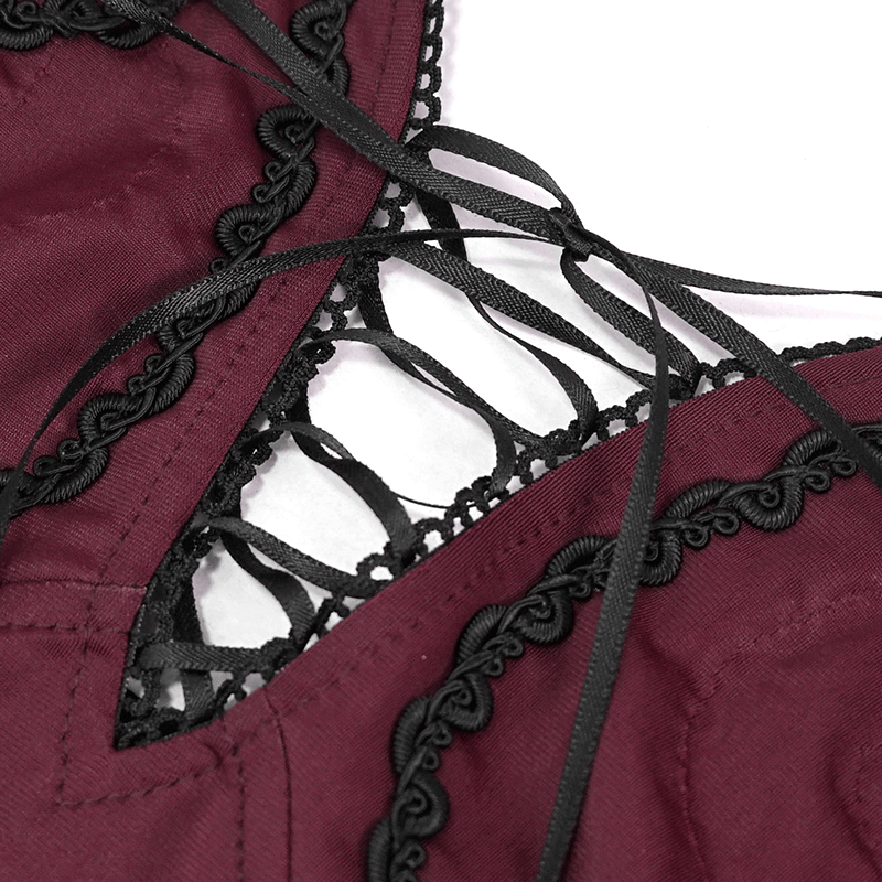 Close-up of gothic style women's wine red swimsuit with black lace and ribbon detailing for a chic look.