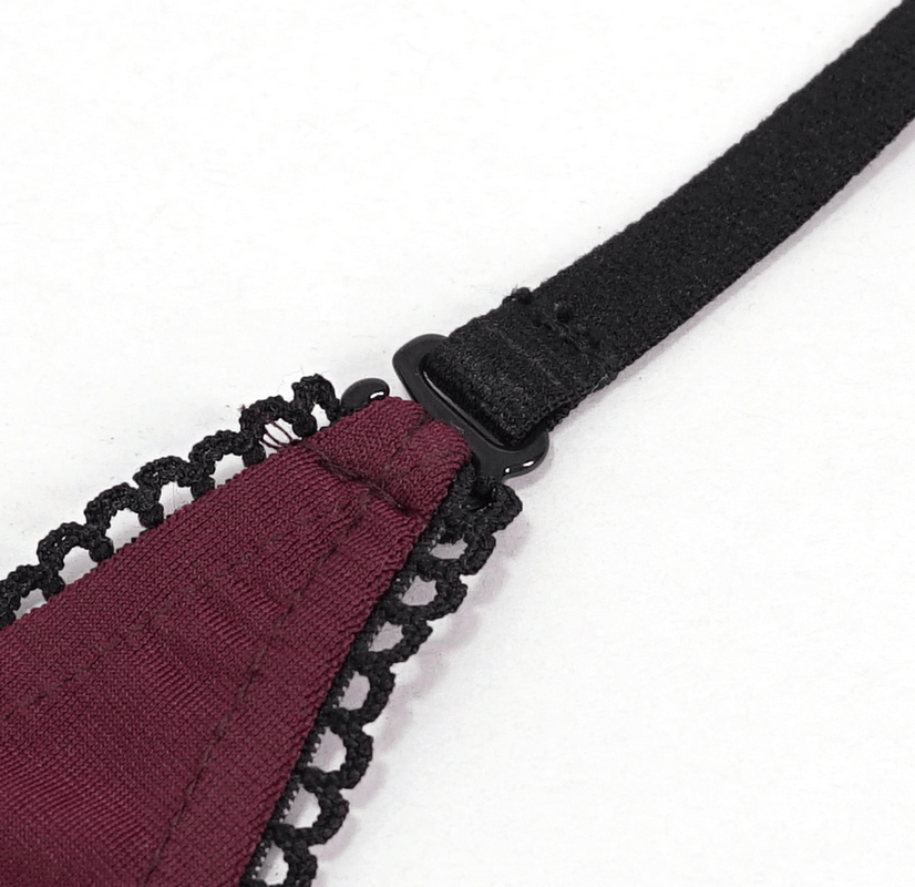 Close-up of the stylish strap of a women's wine red gothic swimsuit with intricate lace detailing.