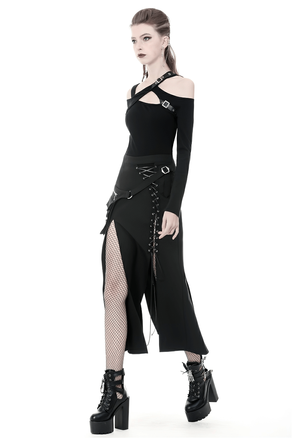 Stylish model wearing an edgy black lace-up skirt with pockets and asymmetrical hem, paired with a fitted black top.
