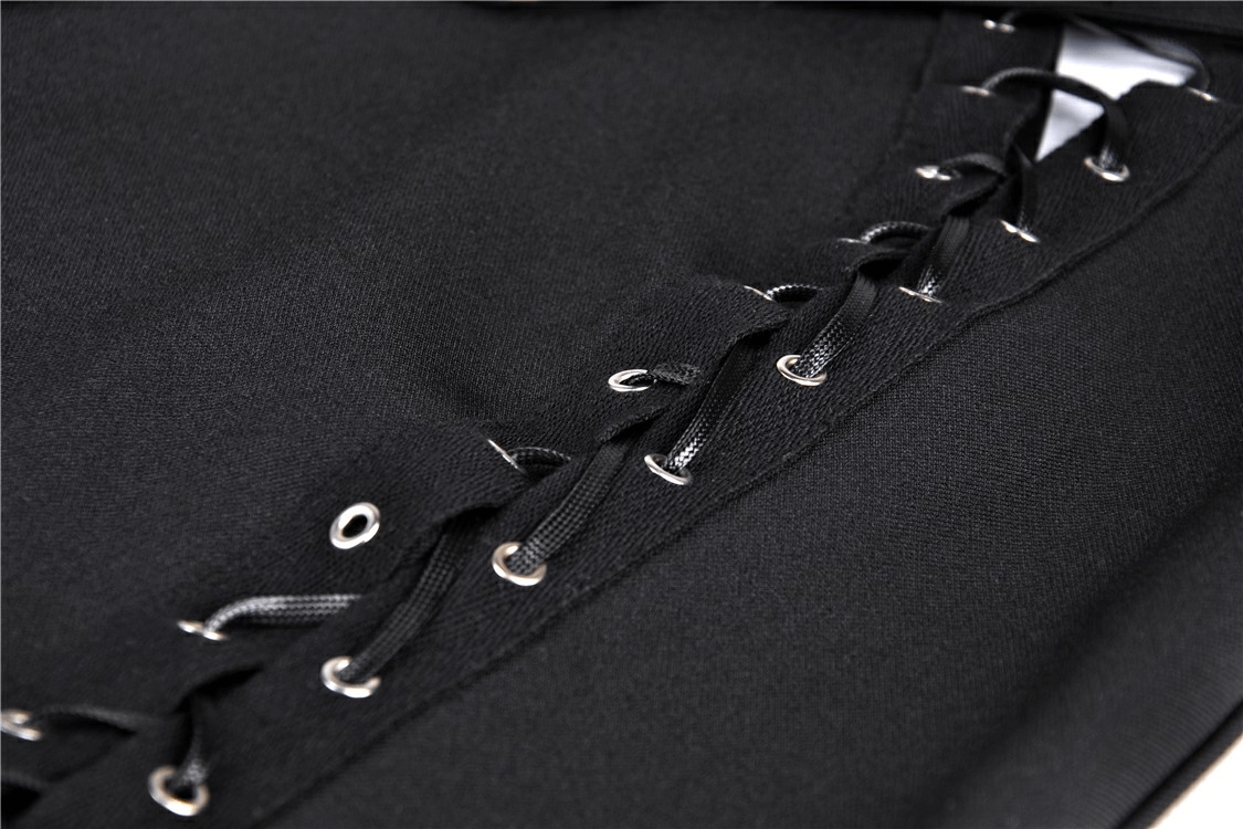 Close-up of black lace-up skirt with metal eyelet details and adjustable laces, showcasing edgy fashion style.