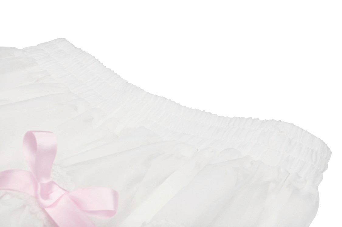 Close-up of a sweet white pleated mini skirt with playful pink bows, perfect for a kawaii fashion look.