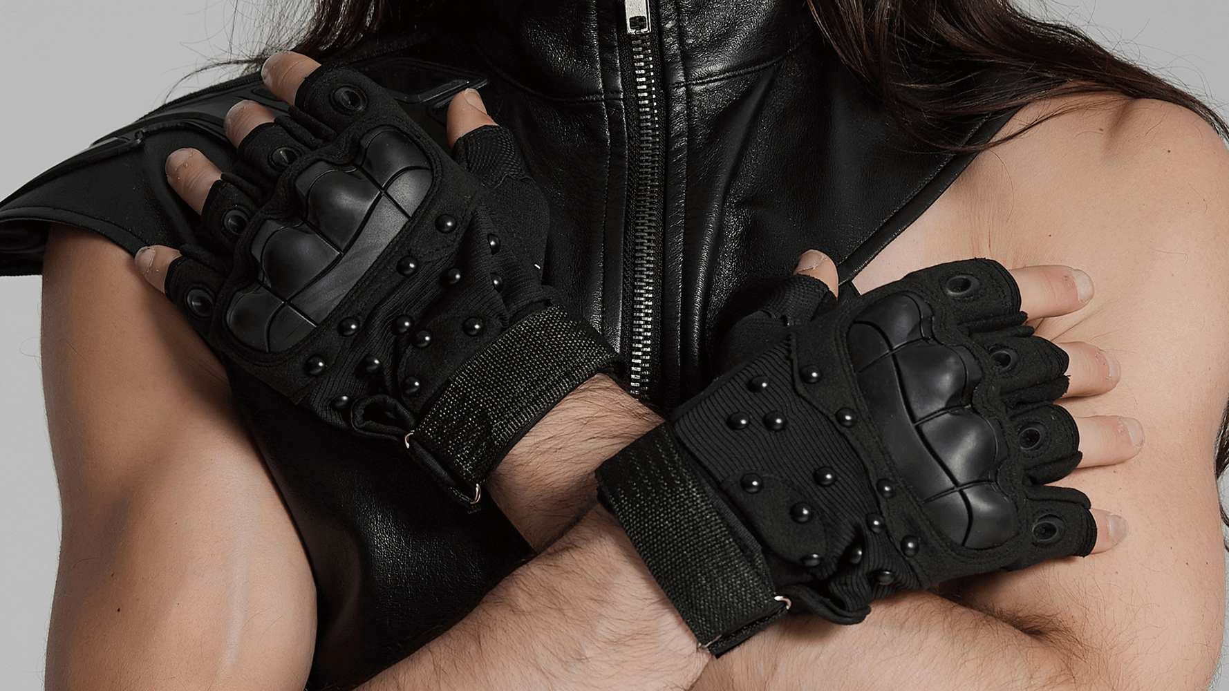 Tactical cyberpunk gloves with protective armor pads and studded design, showcasing durability and grip.