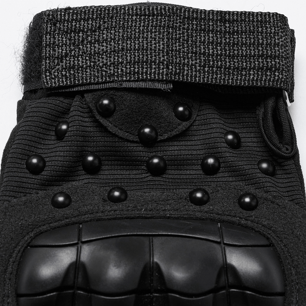 Close-up of tactical cyberpunk gloves showcasing studded design and protective armor pads.