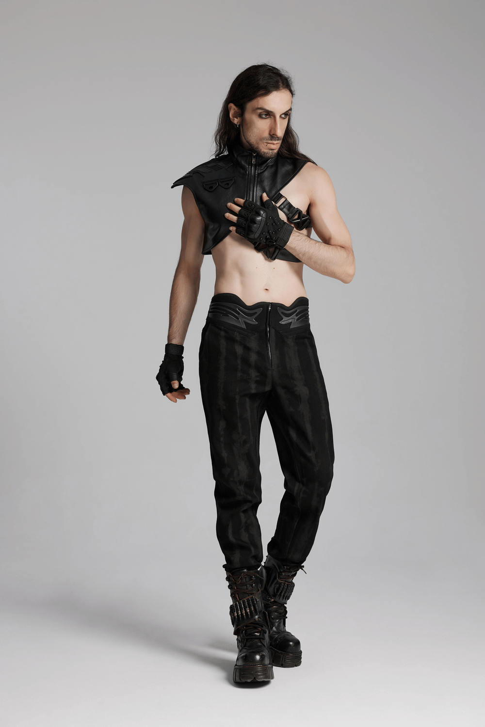 Model wearing black tactical cyberpunk gloves, sleeveless top, and pants, showcasing a bold rebellious style.