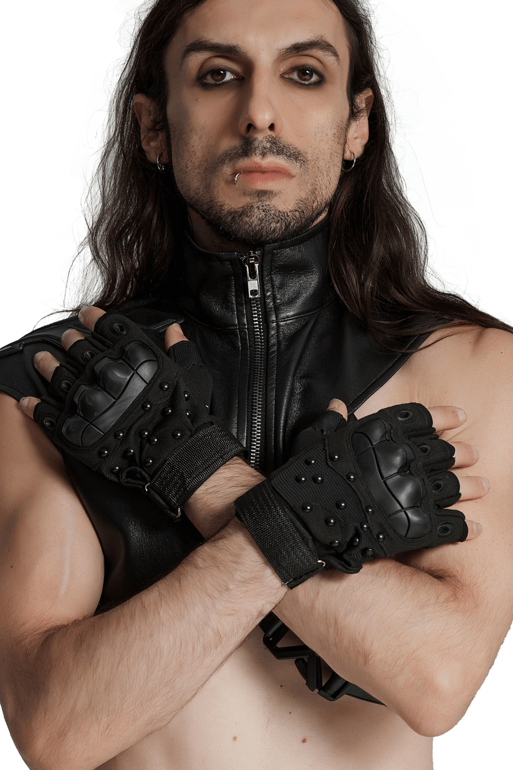 Man wearing tactical cyberpunk gloves with armor pads, showcasing bold studded design and adjustable wristbands.