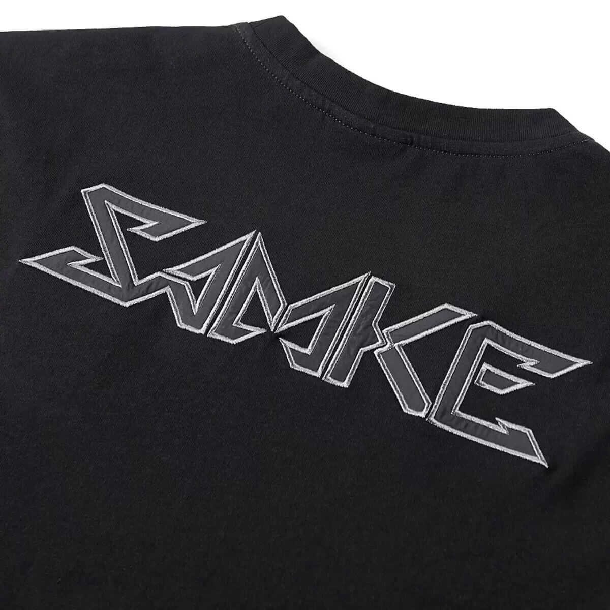 Back view of a black tactical T-shirt featuring a bold "SAMKE" graphic design in silver stitching.