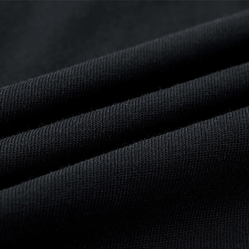 Close-up of soft black fabric showcasing the texture for tactical patchwork t-shirts.