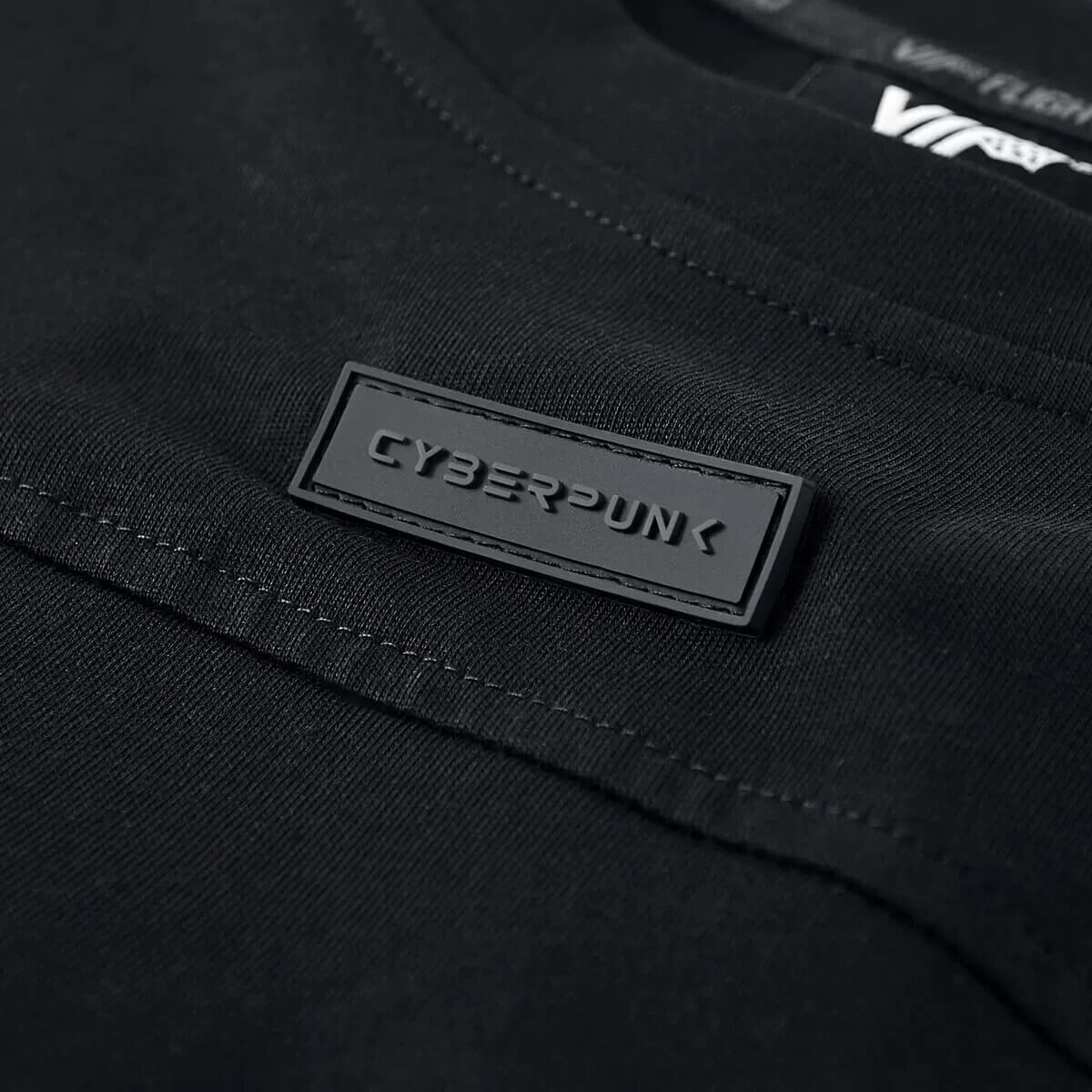 Close-up of a black tactical T-shirt featuring a Cyberpunk label on the chest.