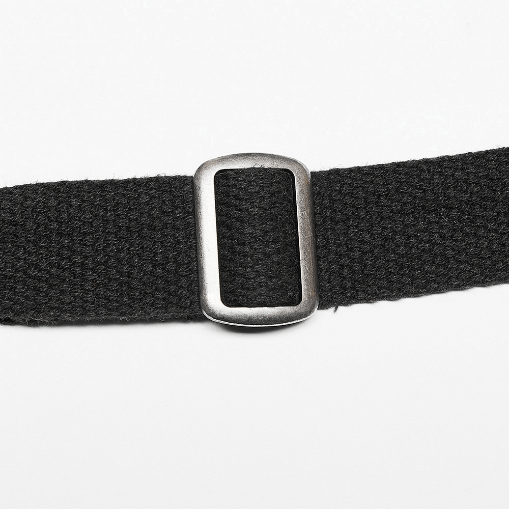 Close-up of a tactical black belt with a metal adjuster buckle, highlighting rugged and stylish details.